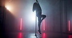 Pole dancing, club and neon with woman in studio for burlesque, stage choreography and performance. Music, dancer practice and performer with person and light for artist, fitness and confidence