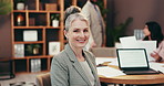 Smile, office and face of woman in meeting for finance with confidence, laptop and screen. About us, risk management and mature businesswoman with computer, support and team workshop for investment