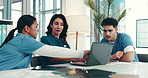 Doctors, meeting and laptop in boardroom at hospital, review and discussion with planning, report and feedback. People, surgeon and nurse in team for diagnosis, insight and medical solution at clinic