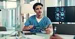 Doctor, man and meeting with x ray for brain scan, tablet or notes for problem solving at hospital. Person, surgeon and touchscreen with mri results, review or app with medical research for neurology