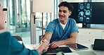Doctor, man and shaking hands at meeting with documents for promotion, smile or hiring at neurology hospital. Person, surgeon and handshake with cv, proposal or medical research paper at brain clinic