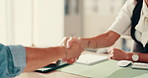 People, handshake and consultation with agreement at hospital for healthcare or appointment or deal. Closeup, doctor and shaking hands with patient for visit, greeting or confirmation at clinic desk