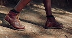 Legs, hiking and person with exercise, walking and nature with recreation, hobby and forest. Closeup, outdoor and hiker with path, wellness and health with journey, trekking or shoes with countryside