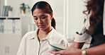 Blood pressure monitor, healthcare and patient in hospital with doctor for assessment or checkup. Consulting, machine and medical with people in clinic for appointment, cardiology and examination