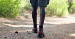 Legs, hiking and person with wellness, walking and nature with recreation, fitness and relax. Closeup, outdoor and hiker with path, countryside and health with journey, trekking or explore with hobby