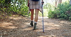 Legs, hiking and person with fitness, walking and nature with recreation, hobby and relax. Closeup, outdoor and hiker with path, wellness and health with journey, trekking or explore with countryside