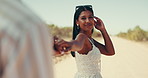 Couple, holding hands and woman in countryside for holiday, vacation and weekend getaway in summer. Walking, happy and people in nature for travel, sightseeing and adventure on road trip outdoors