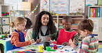 Painting, teacher and children with smile, students and creative in classroom, growth or development. Talking, woman and teaching kids in preschool, learning or education for youth with color for art