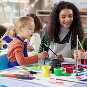 Painting, teacher and children with woman, care and creativity in ...