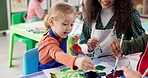 Painting, teacher and children in daycare, color and creativity in classroom, growth and development. Talking, woman and teaching kids in preschool, learning and education for youth with artwork