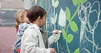 Board, drawing and children with chalk at school for creativity, art or learning together. Education, students and kids writing on wall for development, growth or inspiration at kindergarten.