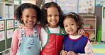 Face, kids and students hug in classroom for learning support, education and growth development. Portrait, happy and children with embrace for creative lesson, kindergarten class and bonding together
