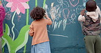Art, mural and creative with children and wall for friends, painting or community project. Flowers, learning and kindergarten education with group of kids in city for volunteer outreach program
