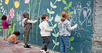 Art, city and creative with children and wall for friends, painting or community project. Flowers, learning and kindergarten education with group of kids and city for volunteer outreach program
