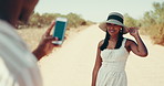 Phone, photograph and road trip with people in desert together for honeymoon, travel or vacation. App, profile picture and social media with couple outdoor in nature for bonding, journey or holiday
