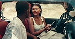 Couple, road trip and phone with map, driving or search for direction for location in countryside. People, woman and man with smartphone, discussion and happy on vacation with mobile app in car