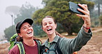 Women, friends and selfie for hiking outdoor with photography, adventure vlog and social media post. Smile, people and laughing for live streaming, profile picture update and travel journey in nature
