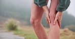 Woman, legs and knee pain outdoor for fitness, exercise and cardio workout accident or training in mountain nature. Joint issue, wellness emergency and athlete person with running injury in forest