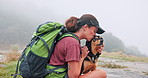 Mountain, hiking and woman with dog, kiss and outdoor adventure path for holiday on weekend. Relax, love and happy person with animal in nature to rest on trekking vacation together in morning fog