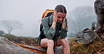 Woman, hike and headache with anxiety in forest, woods or nature for depression, trekking or outdoor walk. Backpack, girl and hiker upset for travel crisis, trip or mental health on holiday vacation