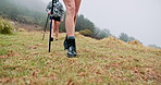 Hiking stick, legs and friends walking outdoor for travel, adventure and journey with fog on mountain. Trip, trekking pole and shoes of women in nature for vacation, balance and exploration together