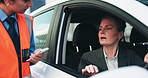 Car, woman and talking to traffic cop, stop and asking driver for documentation, travel and justice. Patrol, police officer and warning for mature person in vehicle, people and public safety on road
