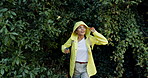 Explore, hiking and woman with stick, raincoat and outdoor adventure holiday on winter weekend. Walking, hill and girl in woods with morning trekking in trees, travel vacation and forest in nature