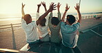 Hands raised, hug and road trip with friends on car bonnet together for adventure, journey or travel. Beach, celebration and sunset with group of people embracing for bonding or vacation from back