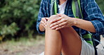 Woman, nature and hands on knee injury with trekking, joint dislocation and fall with pain. Female hiker, fitness and break on hiking trail with leg emergency, accident and torn ligament in woods