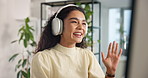 Happy woman, wave or video call with headphones for virtual meeting or online communication at office. Female person, business employee or talking with smile on computer for remote discussion or chat