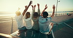 Celebration, hug and travel with people on car bonnet together for adventure, journey or road trip. Beach, hands raised and sunset with group of friends embracing for bonding or vacation from back