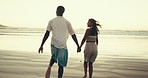 Couple, back and holding hands with running to ocean, support and trust in relationship with tropical travel. Love, care and happy people in commitment with energy on date or honeymoon at beach