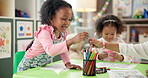 Children, school and students drawing for art, learning and development in kindergarten classroom. Girl kids, writing and together for growth, education and creative group with colors at academy