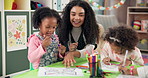 Woman, elementary teacher and kids with drawing in kindergarten classroom for early childhood development. Female person, educator or instructor with children for youth or coloring activity at school