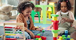 Kid, student and play with blocks in class for learning, problem solving and creative activity. Children, laugh and building fail with education game, puzzle solution and motor growth in kindergarden