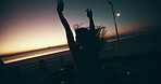 Silhouette, sunset and woman at beach for freedom, travel and road trip by coast. Ocean, back view and person outdoor in car for holiday, adventure and wind in nature with arms raised for happiness