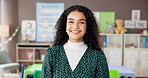 Happy, woman and portrait of teacher at school with education career for child development. Smile, confident and female educator from Brazil with pride for job in classroom at kindergarten academy.