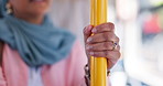 Person, hands and pole with handle on bus for public safety, transport or security on vehicle in city. Closeup, passenger or commuter with holding grip in transportation for road trip or travel