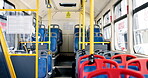 Travel, bus and public transport with empty seats for commute, road trip or urban excursion. City service, vehicle and corridor interior for journey, metro and driving in traffic with tourism or ride