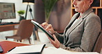 Remote work, business woman and hands on tablet for planning law case or research in home office. Digital technology, communication or mature freelance attorney scroll legal evidence for trial online
