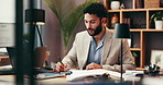 Documents, technology and businessman writing for research, information or report on company budget. Computer, paperwork and male financial manager with investment planning for corporate dividend.