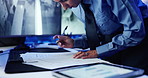 Hands, security and writing with documents by monitor, tablet and notes for safety report with property surveillance. Person, paperwork and log for privacy, control and review record at data center