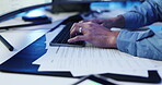 Man, hands and typing on computer with paperwork for surveillance report, patrol logbook or planning. Professional, security guard and technology for witness statement or handover document in office