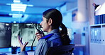 Screen, security guard and woman with radio, surveillance and inspection of footage on monitor and night. Control room, law enforcement and person with tech for communication, service and protection