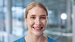Face, happy woman and nurse in clinic for medicine, wellness career and portrait. Smile, physician or medical professional, confident surgeon and healthcare worker or employee in hospital with pride