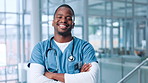 Face, happy black man and confident nurse in clinic for medicine, wellness career and arms crossed. Smile, physician and medical professional with surgeon, healthcare worker and employee in hospital