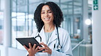 Face, healthcare and tablet with doctor in hospital for review of information or records. Medical, stethoscope and telehealth with happy cardiology professional in clinic for diagnosis or results