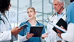 Surgeon, group and doctors in meeting with tablet for planning, health treatment results or clinic. Clipboard, teamwork and people in discussion for medical advice, schedule and hospital research