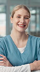 Happy nurse, face and woman with arms crossed at hospital for healthcare service, medical support or about us. Medicine, professional and confidence in portrait for career ambition or treatment trust