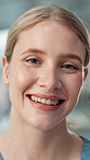 Dentist, face and smile with woman in office of hospital for appointment, checkup or healthcare. Dental hygiene, medical and oral hygiene with medicine professional in clinic to prevent tooth decay